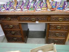 A Victorian carved oak double pedestal desk with leather inset top. COLLECT ONLY.