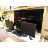 A quantity of flat screen TV's & computer monitors, all untested, some without leads & remotes