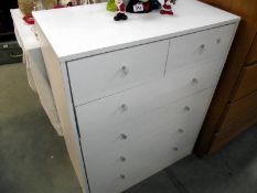 A white melamine chest of drawers 75cm x 40cm x height 93cm