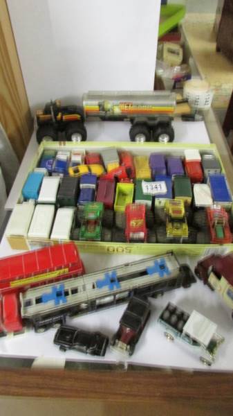 A mixed lot of unboxed die-cast and other vehicles.