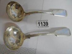 A pair of hall marked silver sauce ladles, 164 grams.