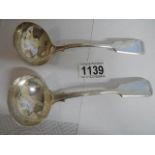 A pair of hall marked silver sauce ladles, 164 grams.