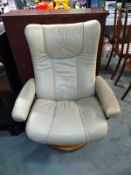 A cream leather swivel recliner chair, COLLECT ONLY