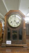 An oak 8 day mantel clock.