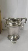 A large silver plate jug marked Nickel Silver, silver plated, 429-67.