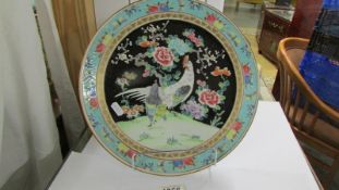 A Chinese plate decorated with domestic fowl, 31 cm diameter. (slight chip