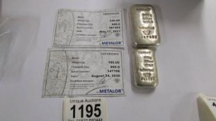 A 250 gram silver bar/ingot and a 100 gram silver bar/ingot.