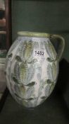 A large Denby jug signed Glyn Colledge. COLLECT ONLY.