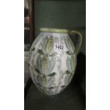 A large Denby jug signed Glyn Colledge. COLLECT ONLY.
