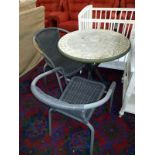 A mosaic top garden table and 2 chairs height and diameter of table (73cm x 70cm), COLLECT ONLY