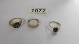 Three 9ct gold rings, sizes L, N and O. 5.1 grams.