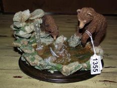 A Country Artists CA792 'An Early Catch' ornament of bear's fishing by B Price, circa 1999.