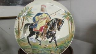 A large hand painted charger of an Arab on horseback, a/f. COLLECT ONLY.