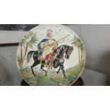 A large hand painted charger of an Arab on horseback, a/f. COLLECT ONLY.