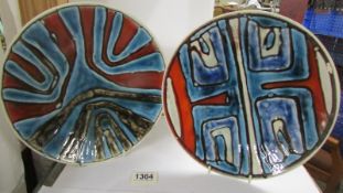 Two Poole pottery plates, 27 cm diameter.