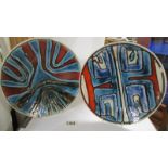 Two Poole pottery plates, 27 cm diameter.