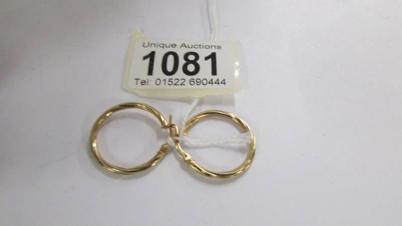 A pair of 9ct gold hoop earrings, 1.4 grams.