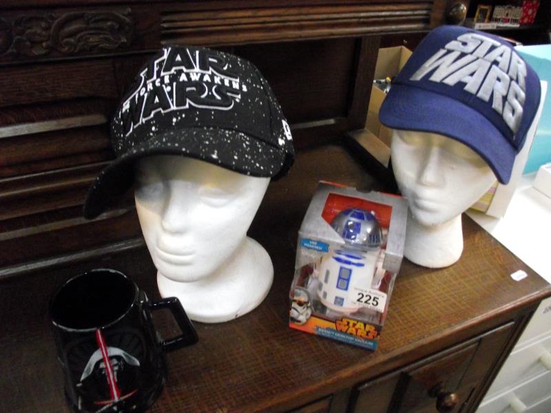 2 new Star Wars caps, a sealed boxed Star Wars desktop vacuum and a Star Wars mug
