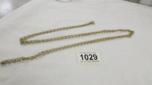 An extra long 9ct gold chain, 140 cm, 25.4 grams.