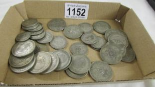 Approximately 280 grams of silver 6d, 1/- and 2/- coins.