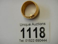 A wide 22ct gold wedding ring, size K. 14 grams.