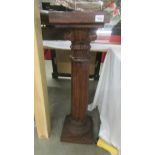 A mahogany Corinthian column torchere. COLLECT ONLY.