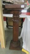 A mahogany Corinthian column torchere. COLLECT ONLY.