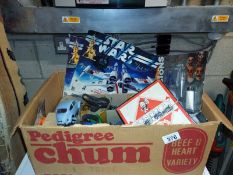 A box of miscellaneous toys including vintage Monopoly, Star Wars, Denys Fisher box fronts.