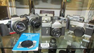 A mixed lot of vintage camera's including Praktica, Zenith, Canon etc.,