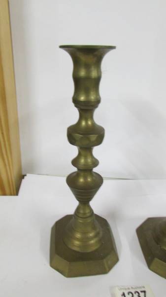A pair of Victorian brass candlesticks. - Image 2 of 2
