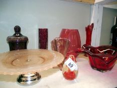 A quantity of red art glass including vases and bowls