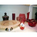 A quantity of red art glass including vases and bowls