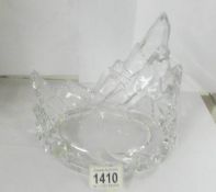 A heavy cut glass stand.