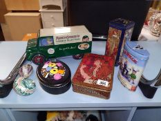 Quantity of collectable tins and 2 sea shells