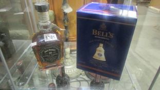 A bottle of Jack Daniels single barrel select Tennessee whisky and a boxed Bells LE whisky,