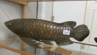 A large bronze pike, 52 cm long and 17 cm high.