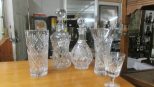 Two cut glass decanters and two cut glass vases. COLLECT ONLY.