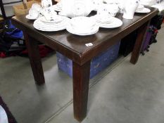 A heavy solid wood dining table. Length 140cm x Width 79cm x Height 78cm COLLECT ONLY