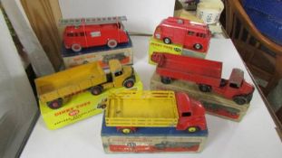 Three Playworn Dinky Bedford Leyland and two fire engines, original boxes. 276, 521, 531, 555, 409.