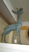 A large brass figure of a stag.