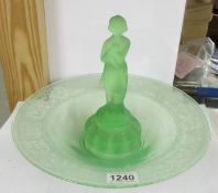 An art deco green glass flower bowl with engraved rim and centre figure.