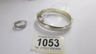 A silver bangle and a silver ring, 16 grams.