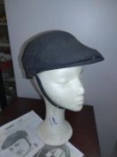 A vintage Chas Owen & Co Moby cap, size 7, Corker motorcycle helmet