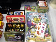 3 tins of Moshi monsters trading cards and gold figures collection plus album of trading cards