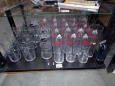 A quantity of glasses including Coors light, Batemans & Carling, all in need of a clean, COLLECT
