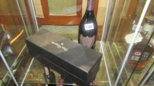A boxed (unopened) 2000 bottle of Dom Perignon champagne and a bottle of Dom Perignon Rose' (1996).