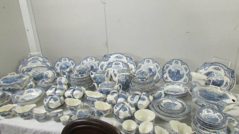 In excess of 200 pieces of Johnson Bros., blue and white tea and dinnerware inc. castle patterns.