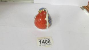 A Royal Crown Derby Robin paperweight with silver stopper.