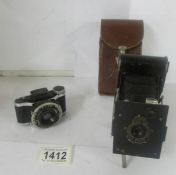 A Kodak Vest Pocket camera and a Lumiere camera.