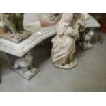 A garden bench supported by lions. COLLECT ONLY.